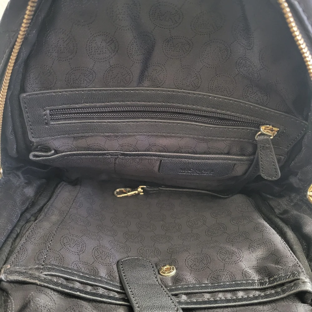 Michael Kors Black Quilted BackpackMichael Kors Black and Gold Quilted Backpack.
